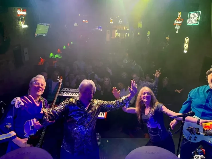 Flying Train Wreck band waving to the crowd