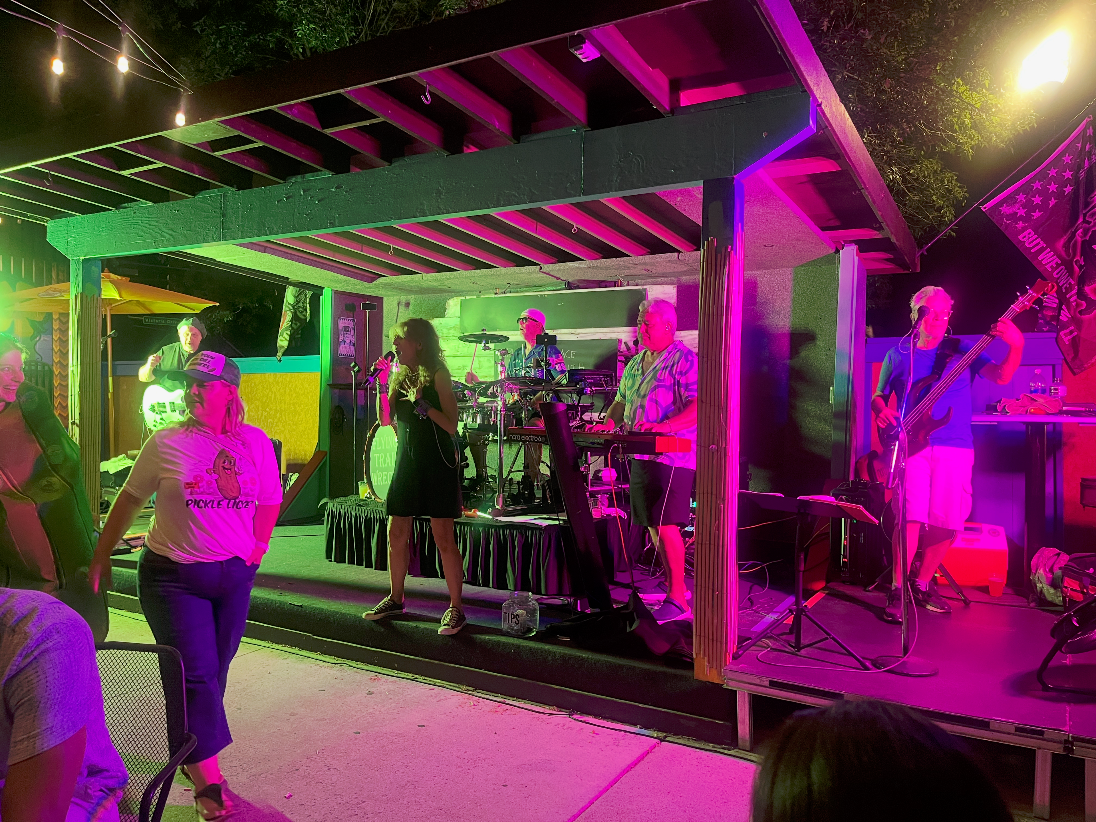 Flying Train Wreck full band performing – green lighting