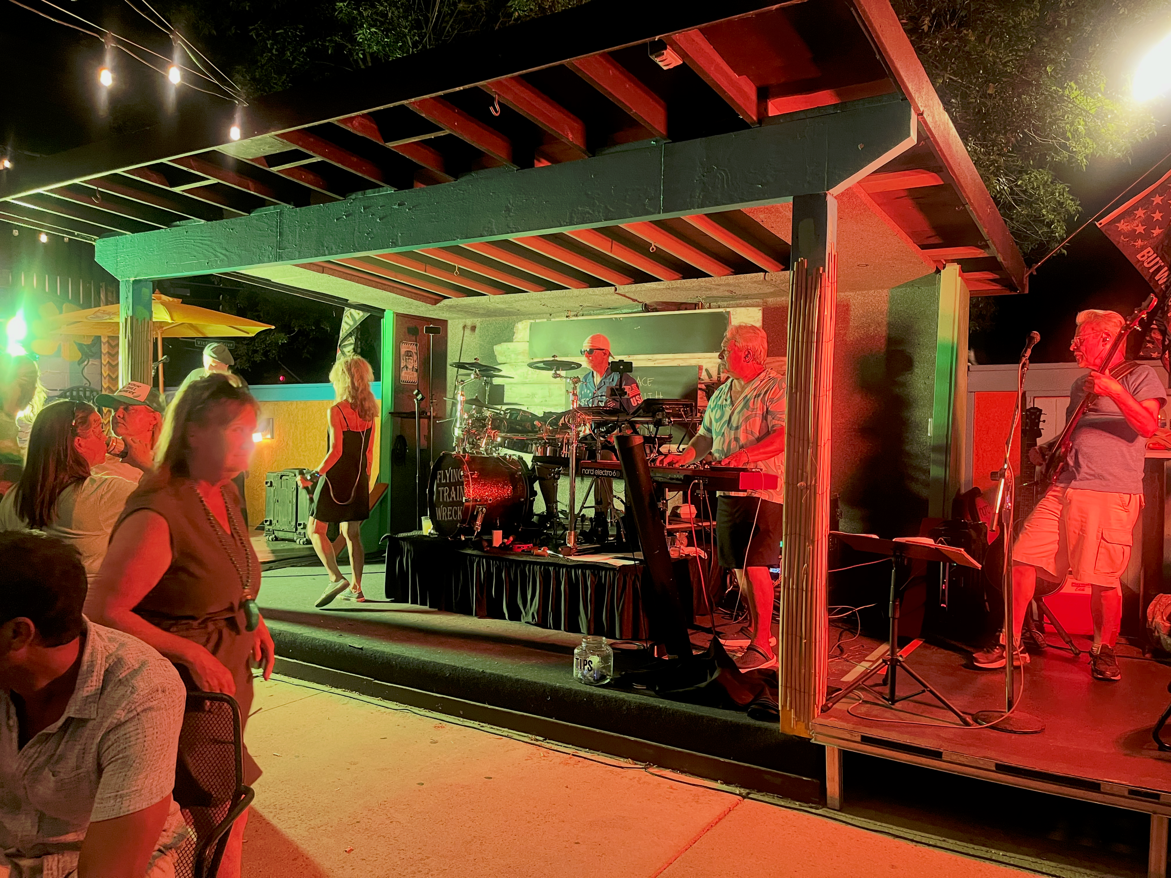 Flying Train Wreck full band performing – red lighting