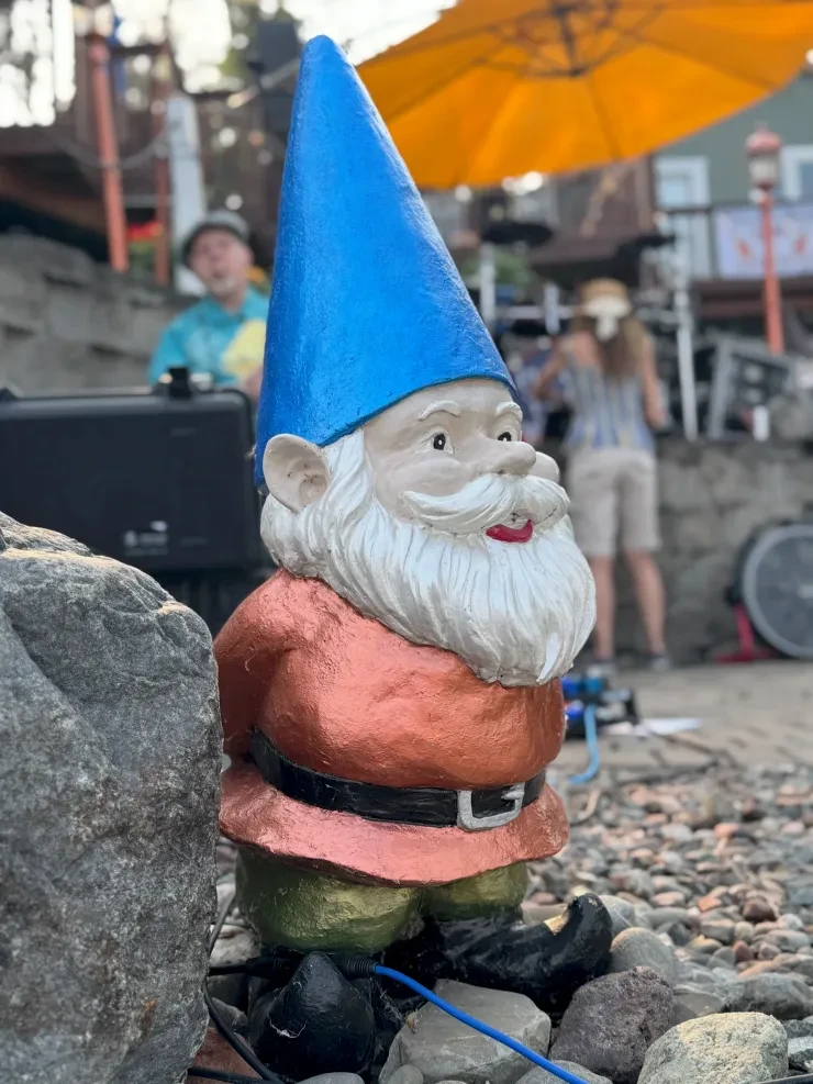 Garden gnome mascot at a Flying Train Wreck outdoor show
