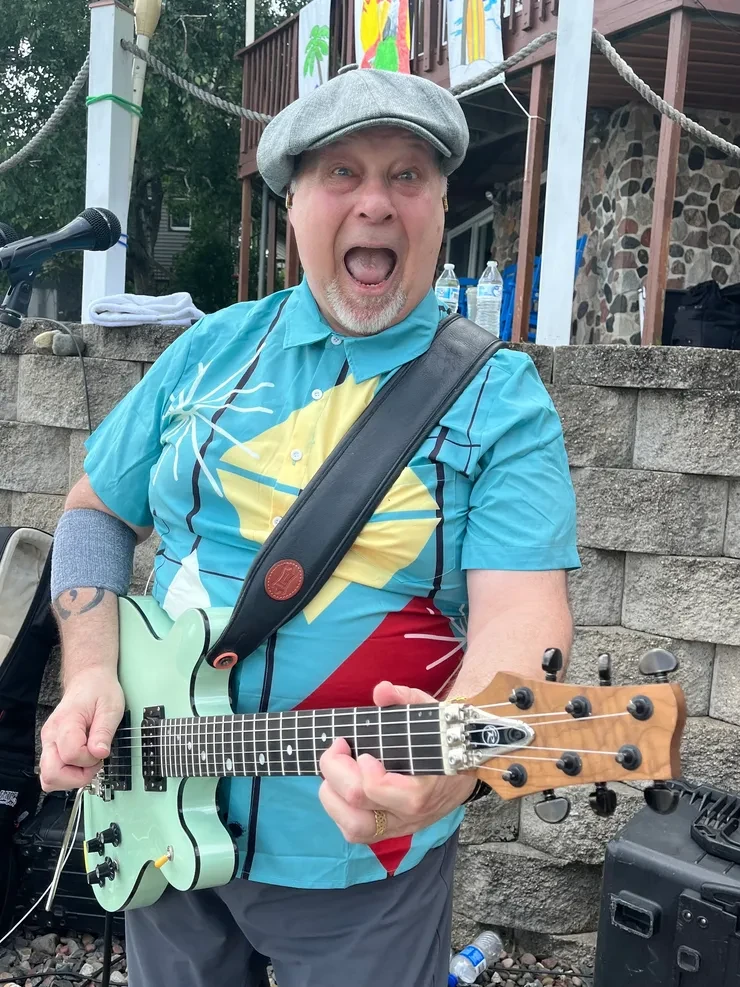 Scot rocking out on guitar at an outdoor private party – Isle Island Bash
